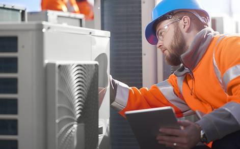 technician works on cooling replacement