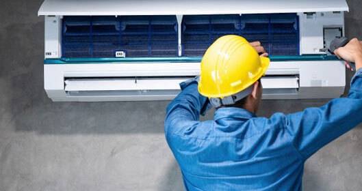 technician works on new air cooling installation